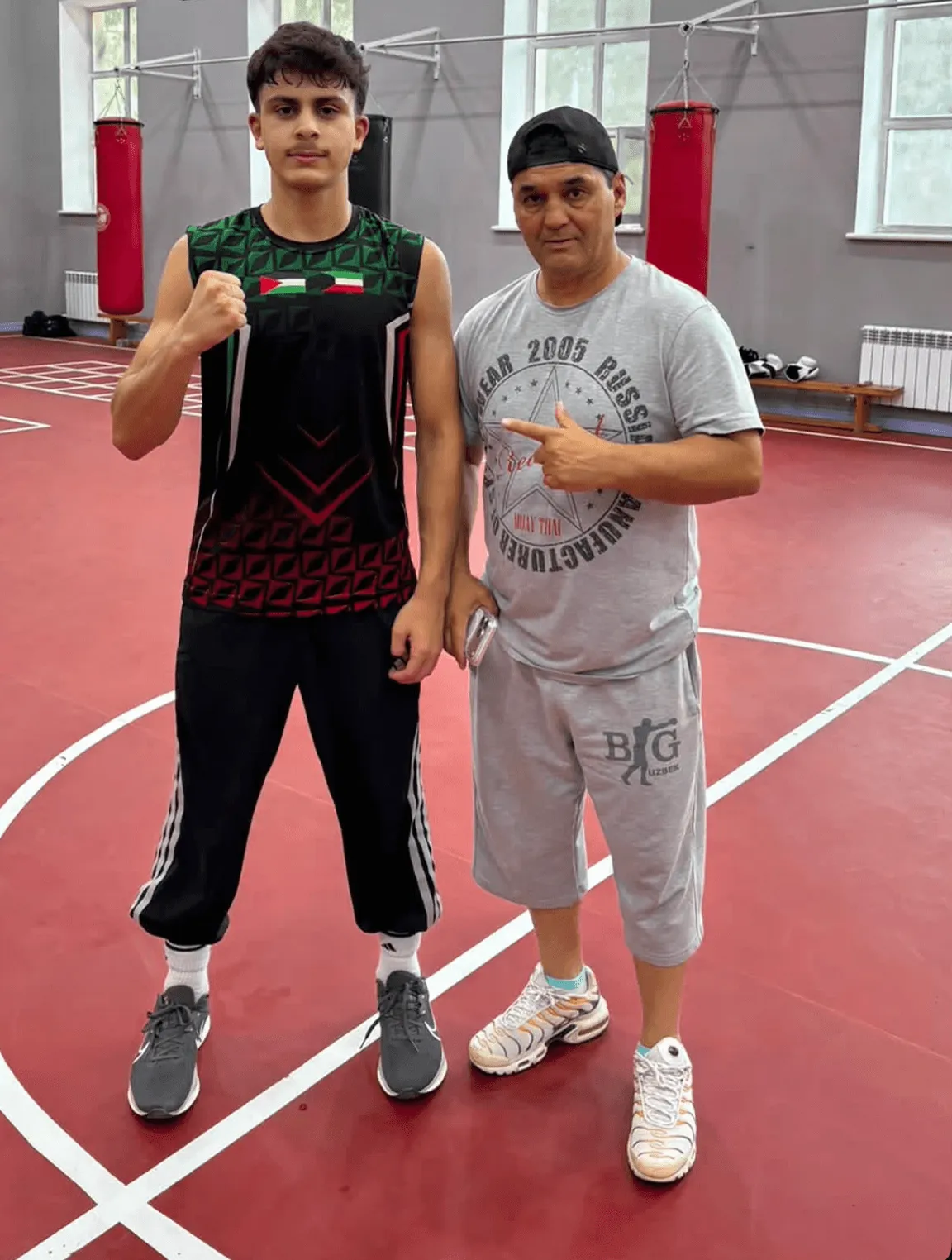 Young boxer with his Uzbek coach
