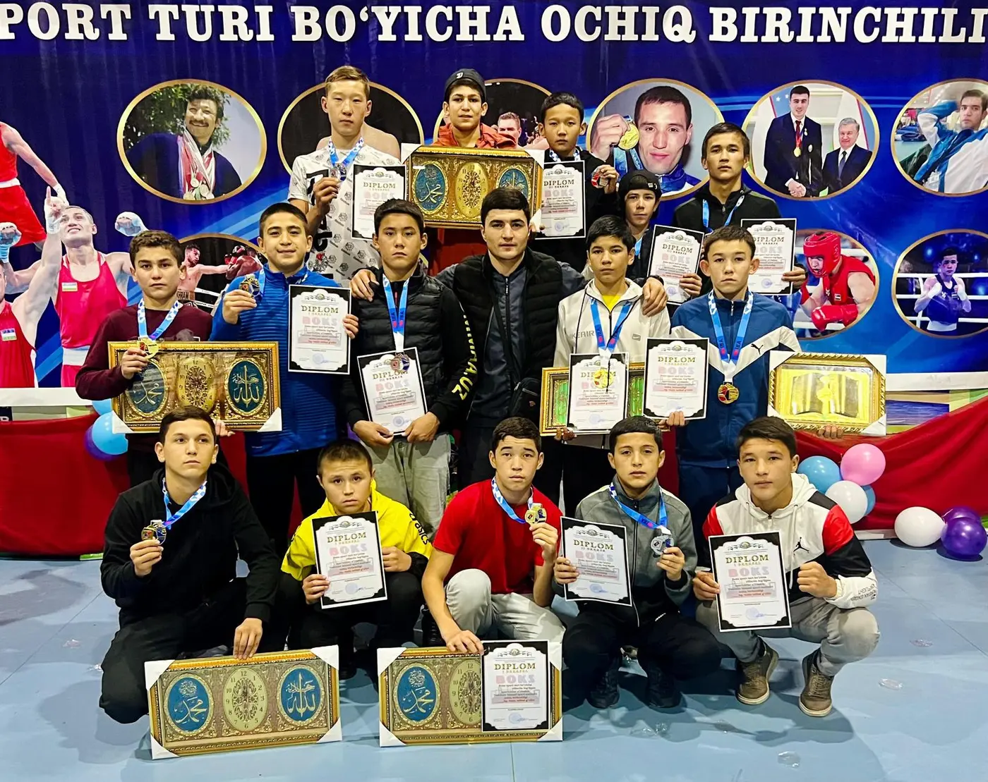 Young boxers with diplomas and medals